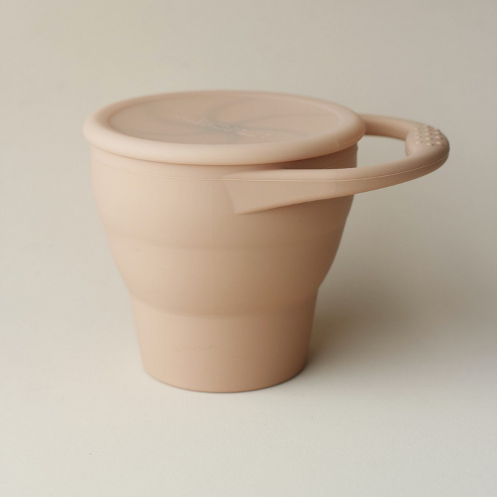 LIttleCHEW dusty pink coral toddler silicone foldable snack cup with hand and lid for snacks on the go
