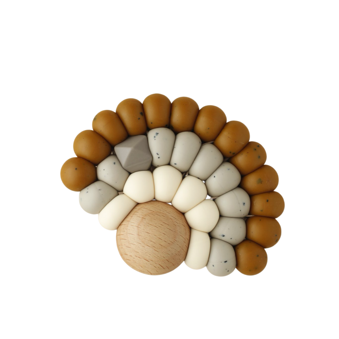 Rainbow shape silicone and wood teether for teething baby in brown grey beige neutral speckle
