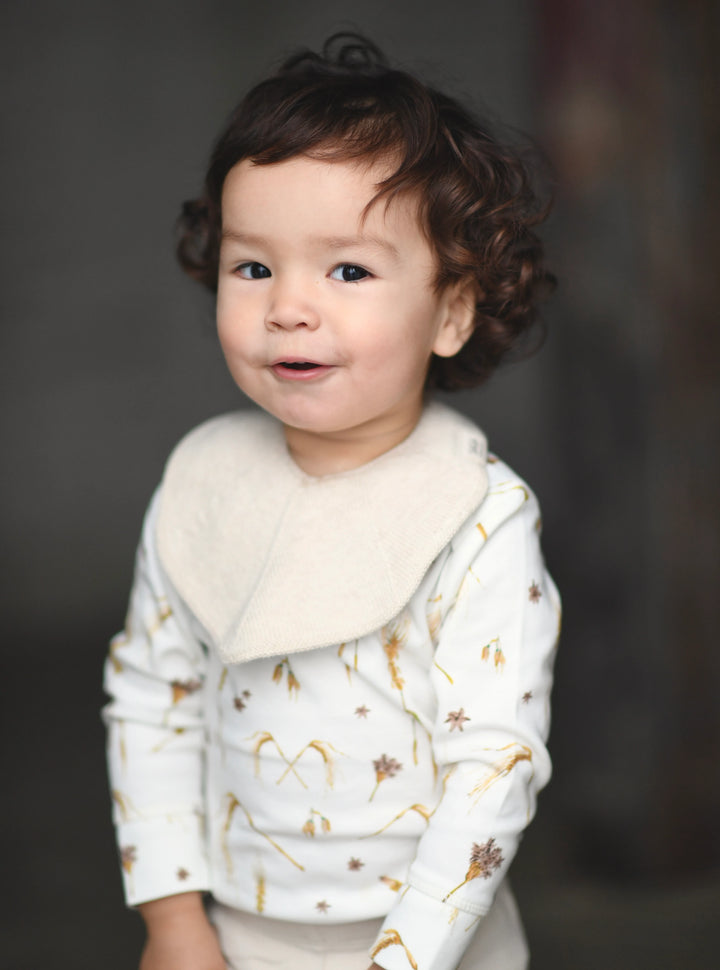 Knitted cotton white off-white cream ivory baby toddler bib adjustable Saga Copenhagen