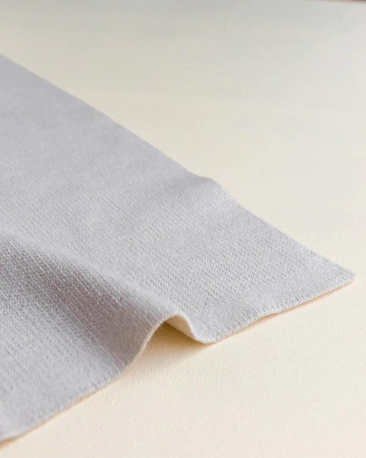 Hvid Knitwear organic merino wool baby kids blanket Edie pattern large polkadot in oat beige sand neutral apricot pink blush for newborn
