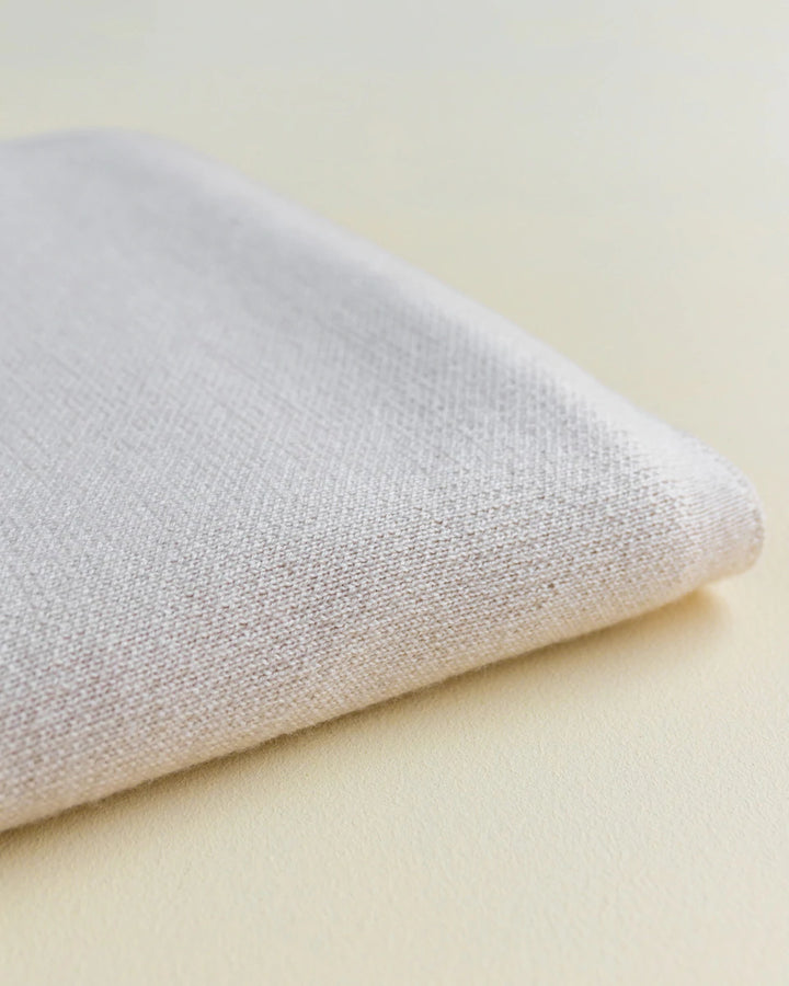 Hvid Knitwear organic merino wool baby kids blanket Edie pattern large polkadot in oat beige sand neutral apricot pink blush for newborn