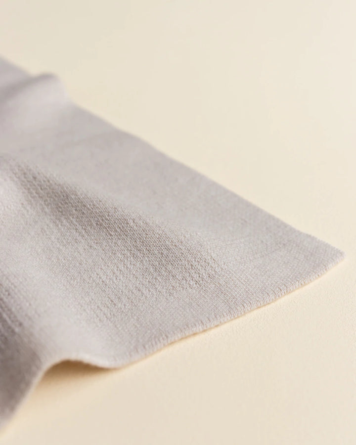Hvid Knitwear organic merino wool baby kids blanket Edie pattern large polkadot in oat beige sand neutral for newborn