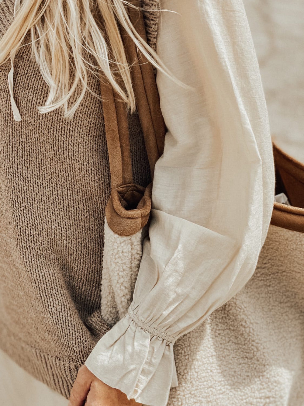 Large shopper bag with handles white off-white beige ecru teddy boucle fabric closeup of woman wearing it