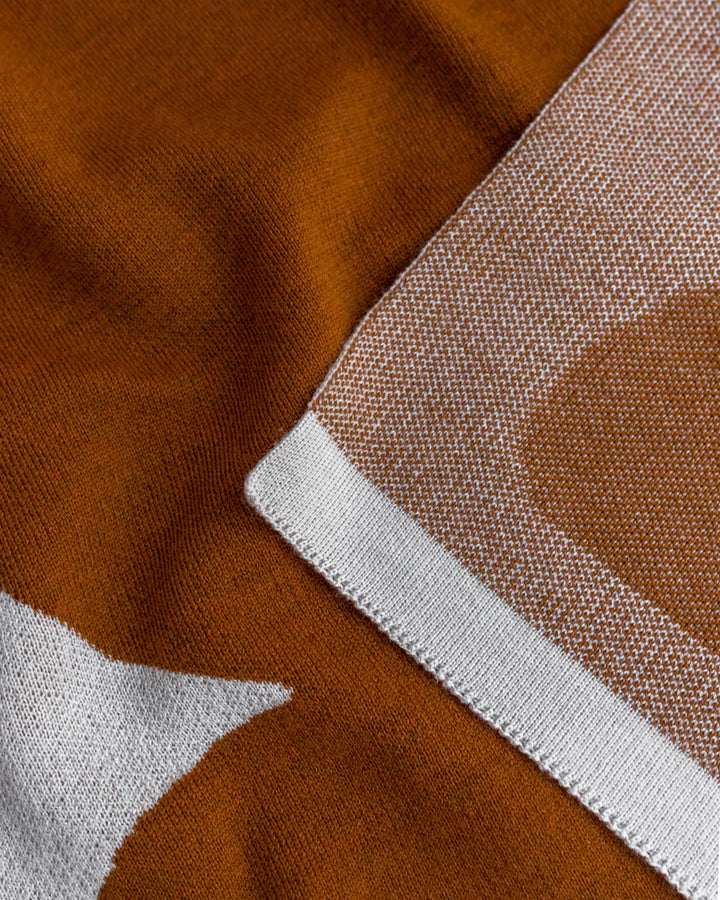 Hvid Knitwear organic merino wool large baby kids blanket Folie in rust brown apricot blush pink with modern geometric pattern for newborn