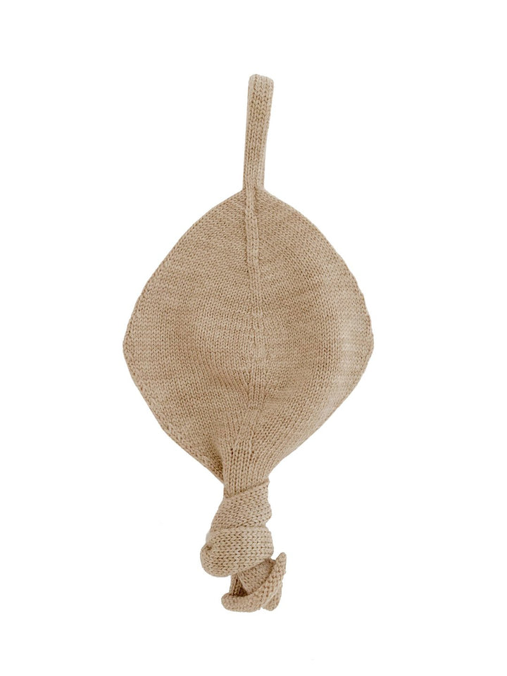 Sand beige knitted merino wool comforter with strap for dummy attachment