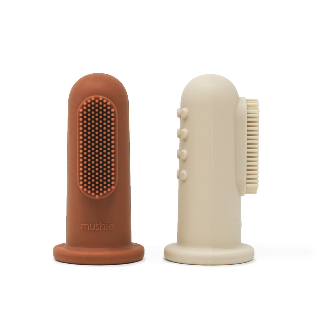 Brown and white finger toothbrush baby