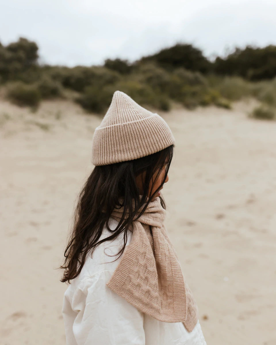 Hvid Knitwear Merino Wool Rib Winter Beanie Hat Fonzie for Kids and Toddlers in rose peach pink apricot  and white jacket worn by girl at beach 
