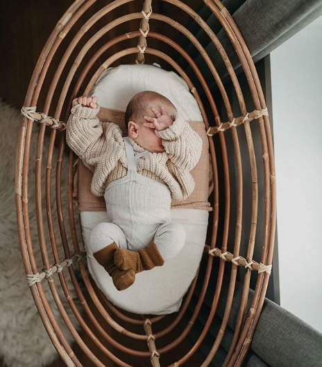 Baby in rattan bassinet wearing Silly Silas cream beige white cotton ribbed tights with braces/suspenders