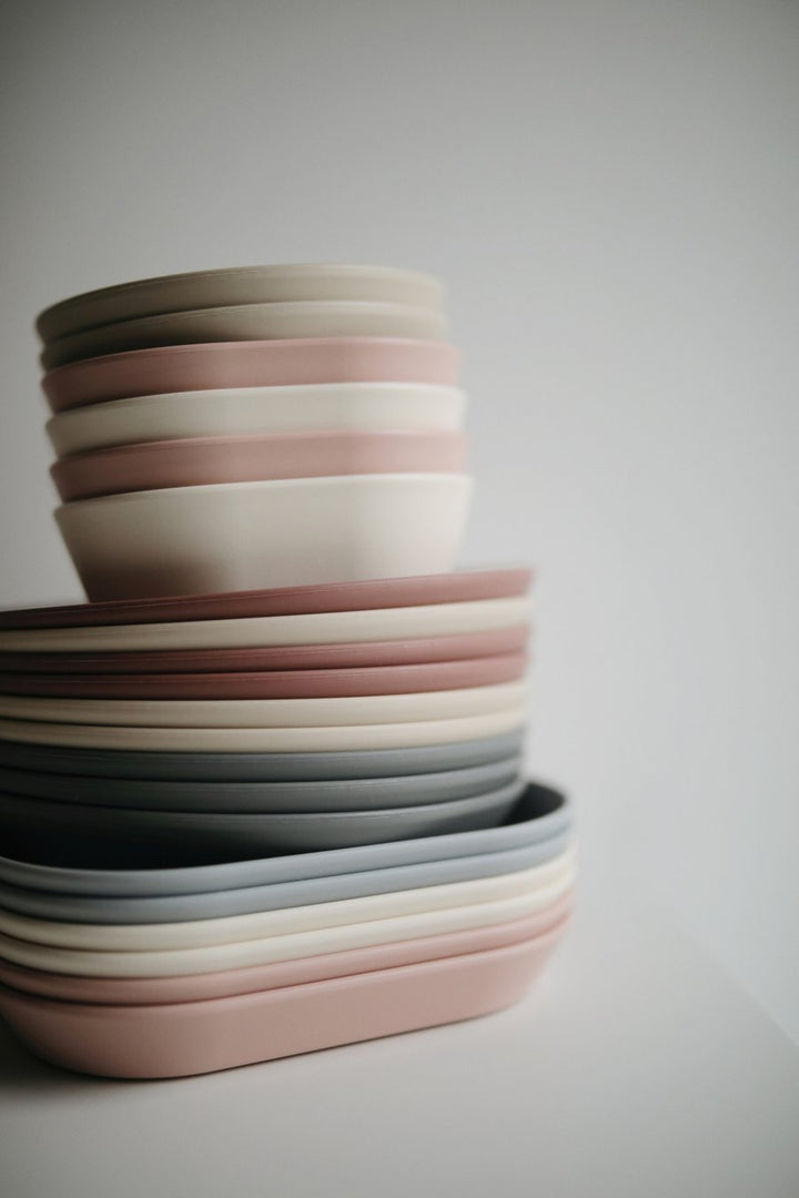 Mushie stack of kids dinner plates and bowls
